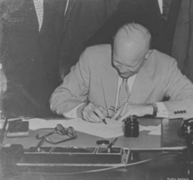 Dwight Eisenhower signing a bill